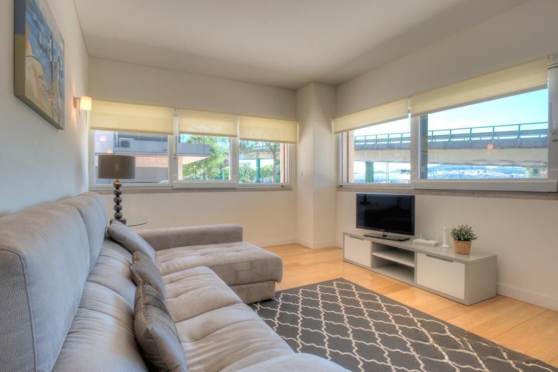 Deluxe Apartment | Living area | 31-inch TV with cable channels