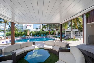 2 outdoor pools, open 8:00 AM to 7:00 PM, pool umbrellas, pool loungers