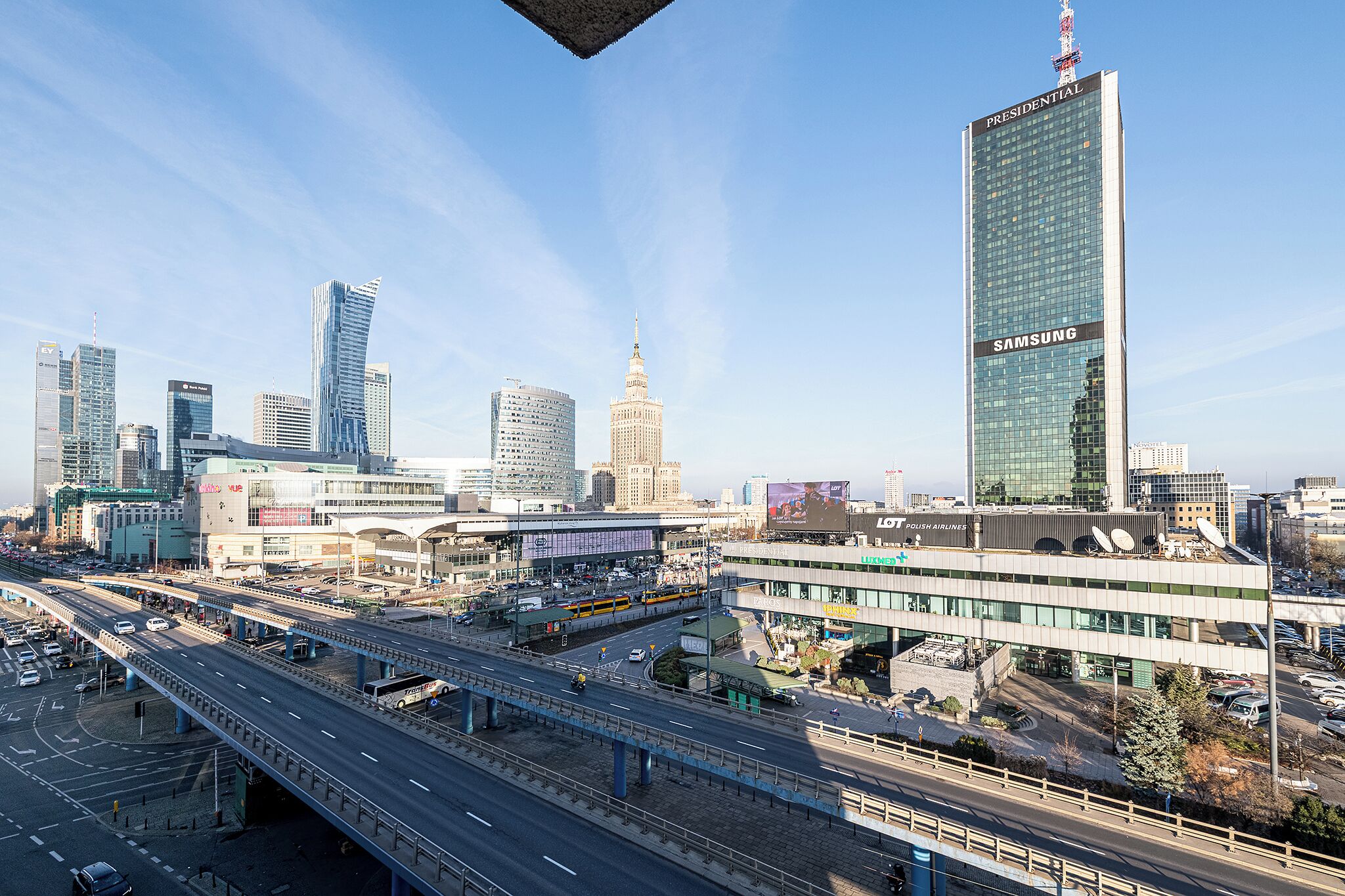 A cityscape with modern buildings, including a prominent Samsung skyscraper.
