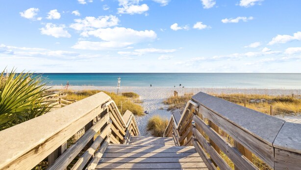 A wooden boardwalk leading to a beach with a clear sky and calm sea. - Spacious Family Retreat w/ Pool, LSV, 7 Bikes, & Generous Outdoor Space w/BBQ (Dune Allen)