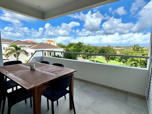 Outdoor dining - 2 bedroom apt at blue bay resort / 5 min walk from beach / pool / private patio (Willemstad)