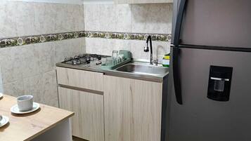 Family Apartment | Private kitchen | Full-size fridge, oven, stovetop, highchair