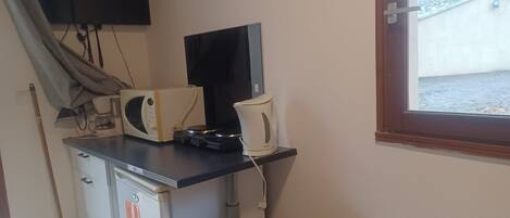 Fridge, microwave, stovetop, coffee/tea maker