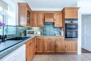 Oven, dishwasher, high chair, cookware/dishes/utensils