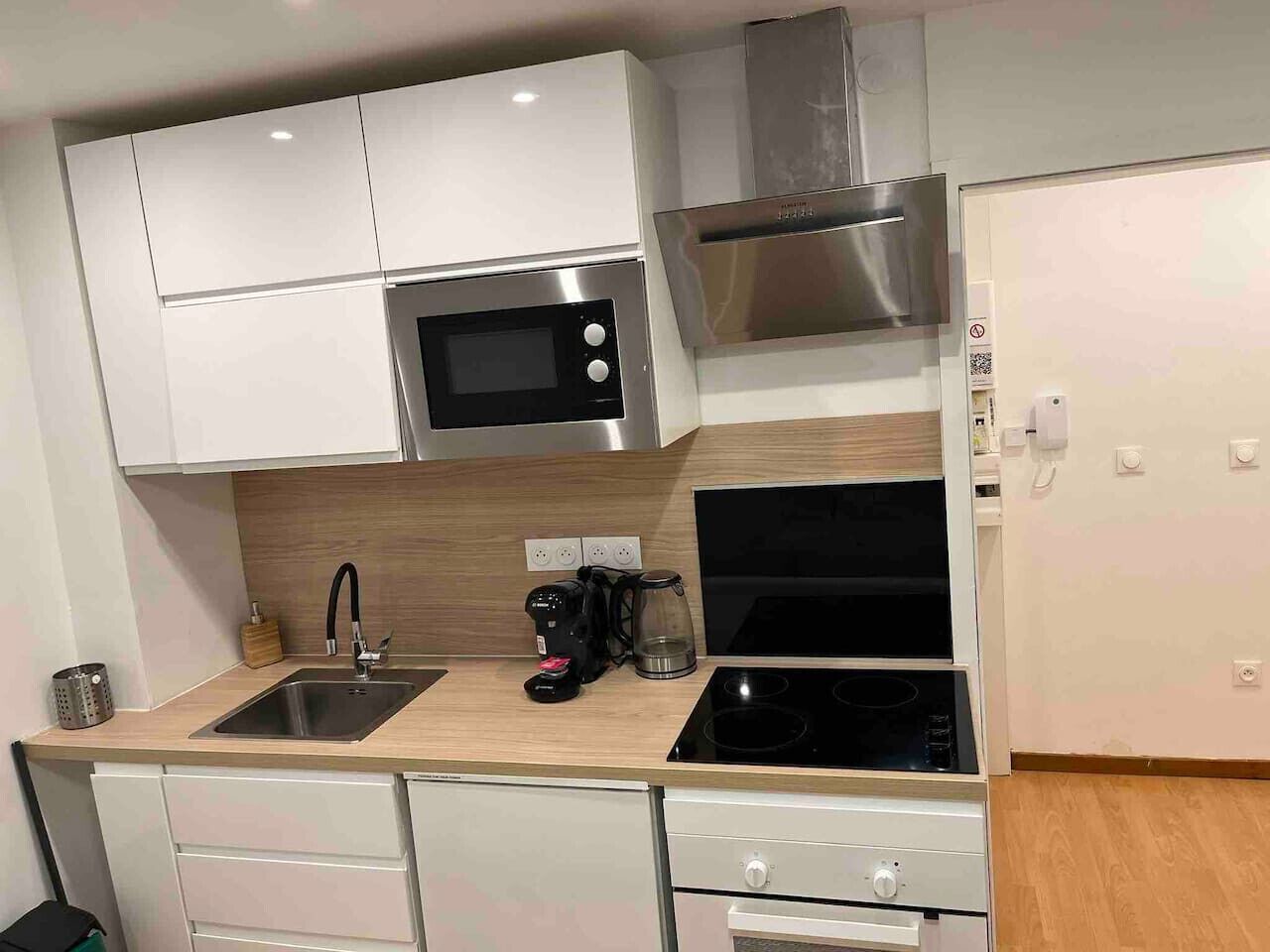 Fridge, coffee/tea maker, cookware/dishes/utensils, dining tables