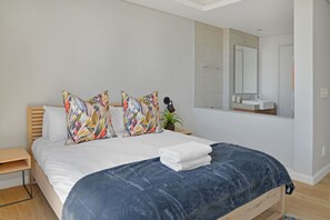 Desk, iron/ironing board, free WiFi, bed sheets - Modern 1-Bed V&A Waterfront | Canal & Harbor Views (Cape Town)