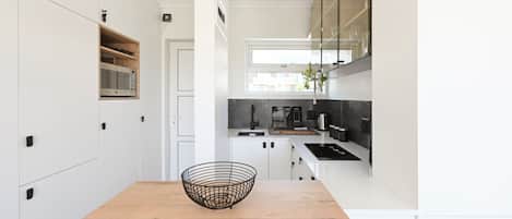 Fridge, microwave, stovetop, coffee/tea maker