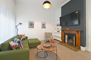 TV, fireplace, offices - Elegant Three Bedroom Home (Cape Town)