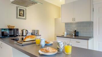 Microwave, oven, high chair, cookware/dishes/utensils