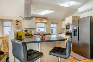 Oven, dishwasher, high chair, cookware/dishes/utensils