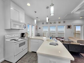 Fridge, microwave, oven, stovetop - Crystal By The Ocean - Front Row 4 Bedrooms 2.5 Bath Sleeps 10 (Crystal Beach)