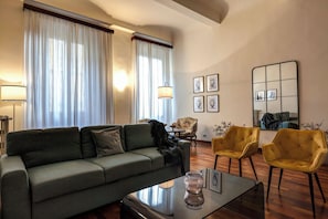 Apartment | Living area | 30-inch flat-screen TV with satellite channels - Pergola Apartment by Mamo Florence (Florence)