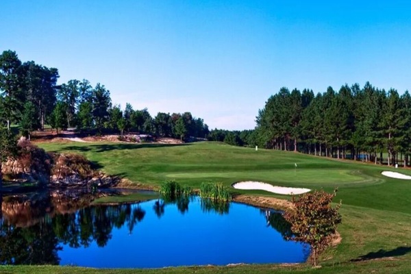 Escape outdoors with nearby greens and peaceful water views.