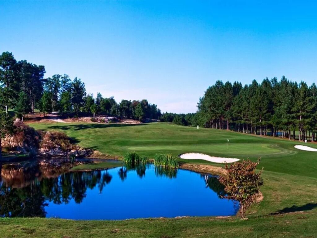 Escape outdoors with nearby greens and peaceful water views.