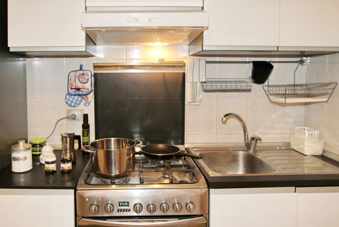 Fridge, stovetop, cookware/dishes/utensils, paper towels