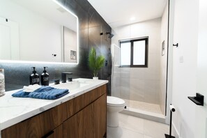 Shower, hair dryer, towels, soap