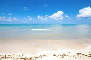 On the beach, sun-loungers, beach towels
