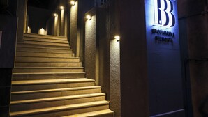 A staircase leading to a building with illuminated signage reading "Broummana Belmondte." - Nice studio with AC in charming Broummana perfect for relaxing stays (Broummana)