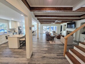 Smart TV, fireplace, books, computer monitors