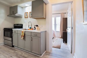 Fridge, microwave, stovetop, coffee/tea maker