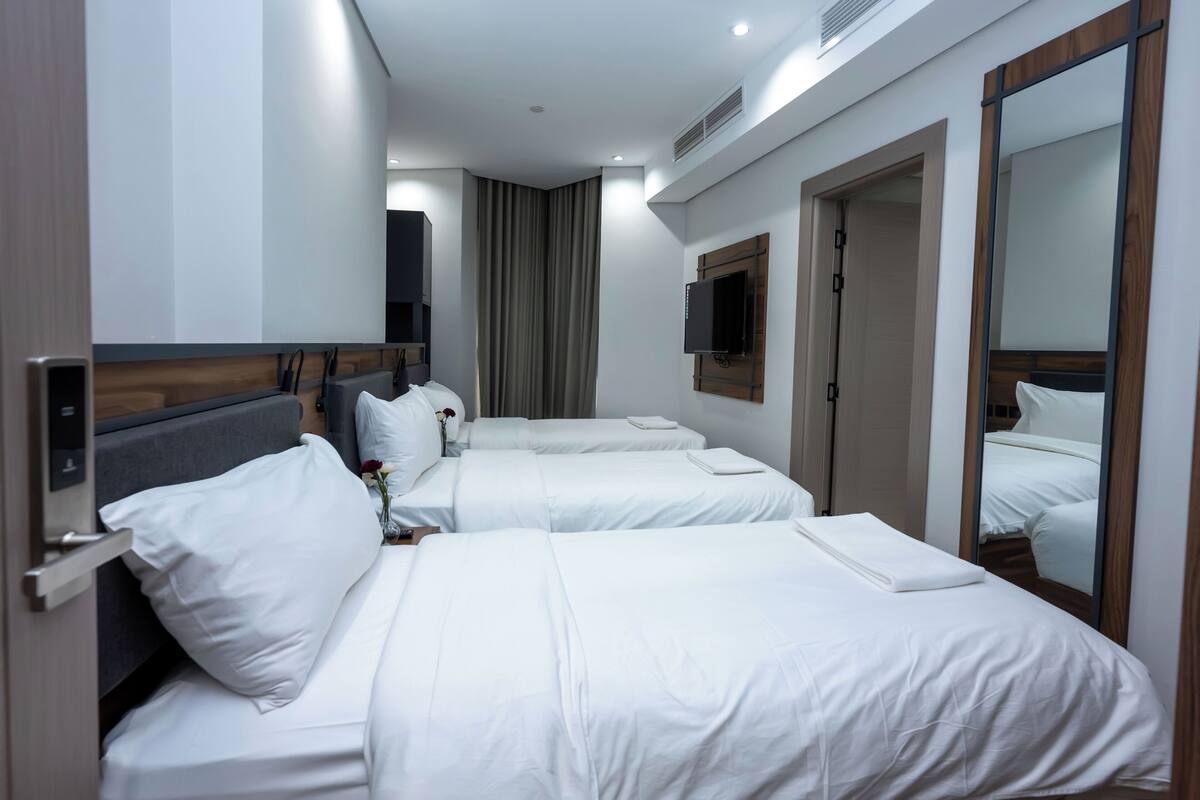 Chambre quadruple Deluxe | Accès au Wi-Fi (inclus), literie fournie