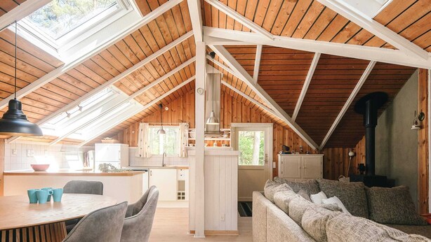 A cozy loft-style interior with a dining area, kitchen, and seating space. - 6 Person Holiday Home in Hadsund (Hadsund)