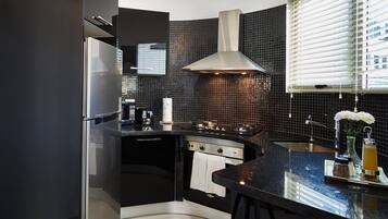 Luxury Apartment | Private kitchen | Full-size fridge, microwave, oven, stovetop
