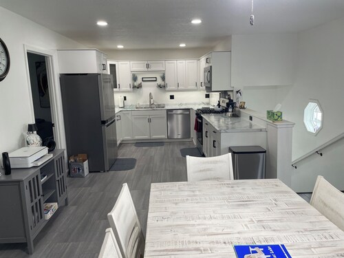 Lakeside 6-bdrm 4-bath with game room, golf cart & semi private dock.