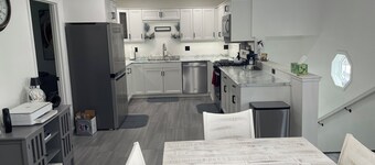 Lakeside 6-bdrm 4-bath with game room, golf cart & semi private dock.
