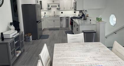 Lakeside 6-bdrm 4-bath with game room, golf cart & semi private dock.