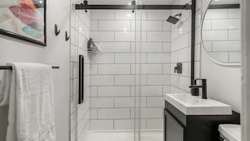 Shower, hair dryer, towels, shampoo