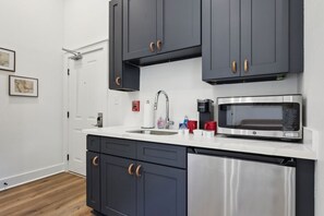 Microwave, coffee/tea maker, cookware/dishes/utensils - Spacious 2BR Condo in the Heart of NOLA (New Orleans)