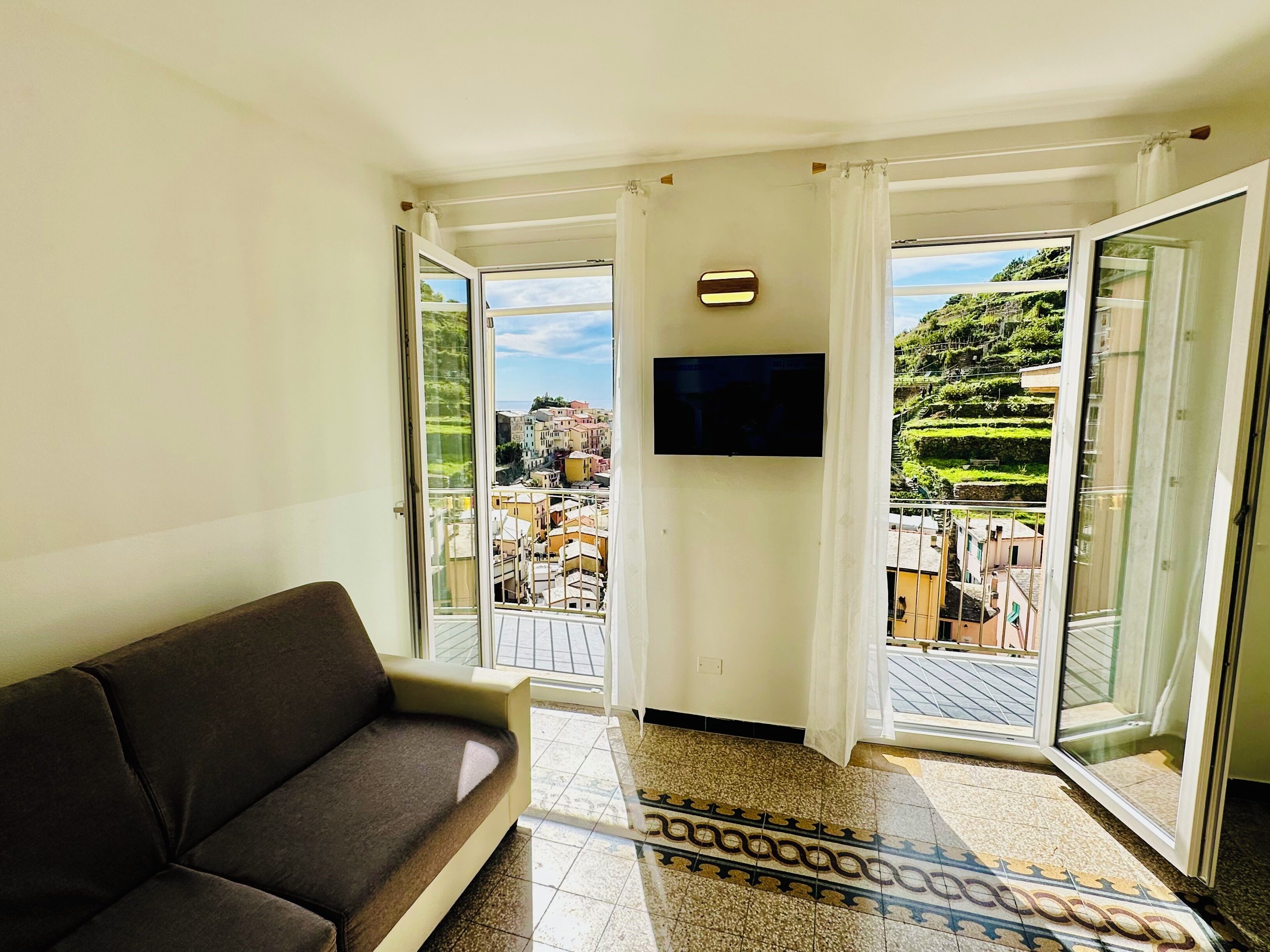 Panoramic Penthouse, Multiple Beds, Balcony, Ocean View | Living area | 32-inch LED TV with cable channels