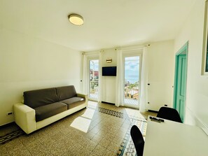 Panoramic Penthouse, Multiple Beds, Balcony, Ocean View | Living area | 32-inch LED TV with cable channels