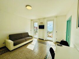 Panoramic Penthouse, Multiple Beds, Balcony, Ocean View | Living area | 32-inch LED TV with cable channels