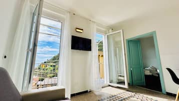 Panoramic Penthouse, Multiple Beds, Balcony, Ocean View | Living area | 32-inch LED TV with cable channels