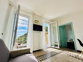 Panoramic Penthouse, Multiple Beds, Balcony, Ocean View | Living area | 32-inch LED TV with cable channels