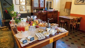 A buffet table with various food items and a tea station. - La Corte del Governo 565 (Lezzeno)