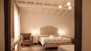 A bedroom with a bed, a chair, a nightstand, and a dresser. - Self-contained apartment with independent access in Farmhouse. (Toscana)