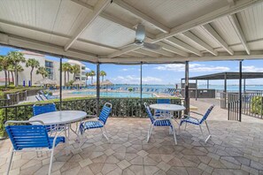 Outdoor dining - Waterfront Retreat in St. Petersburg – Spacious 2-BR Condo with Balcony & Pool (Isla Del Sol)