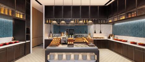 A modern kitchen with a central island, built-in appliances, and a herringbone tile backsplash.
