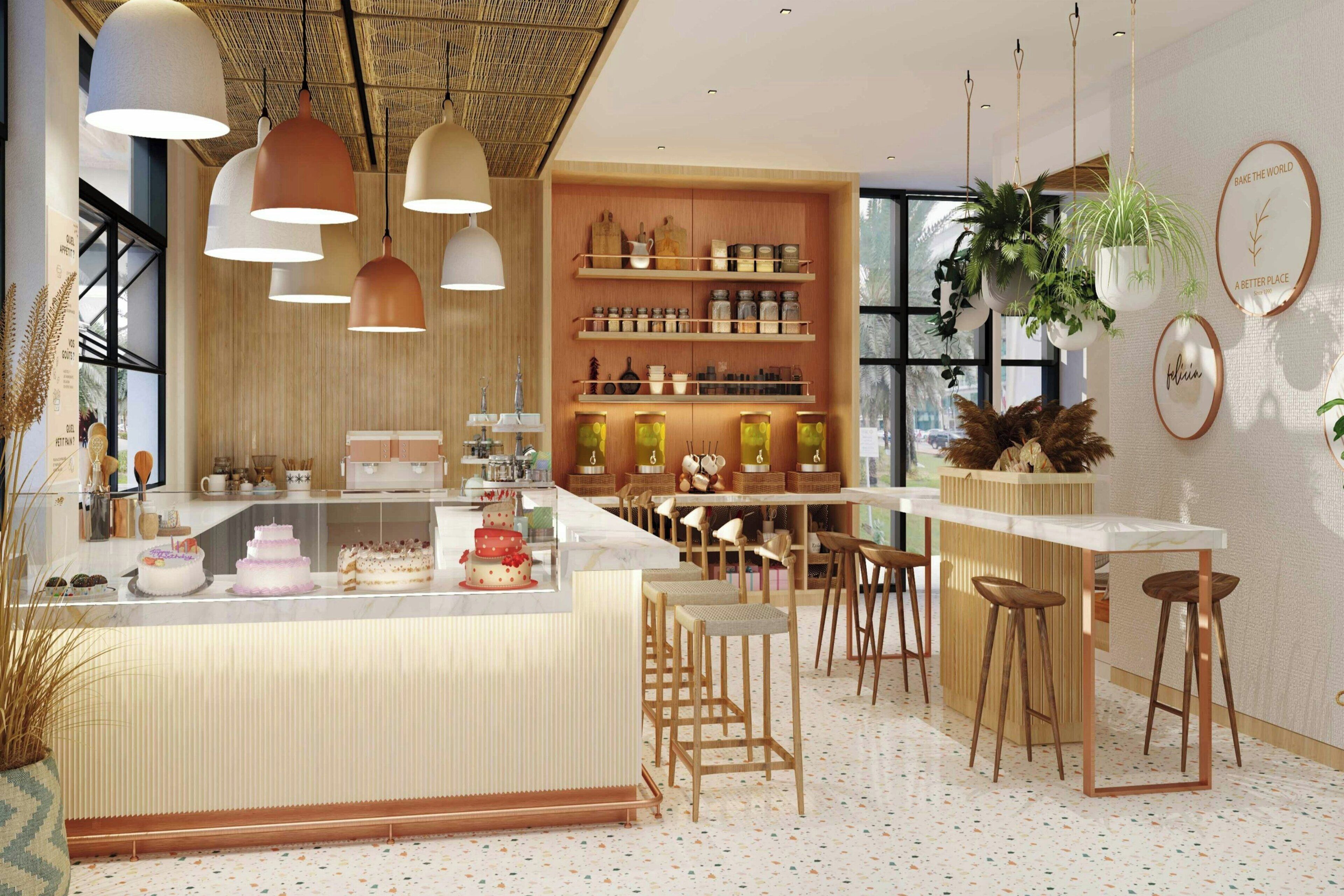 Una cocina moderna con una isla central, taburetes de bar, plantas colgantes y una variedad de utensilios de cocina en estantes.