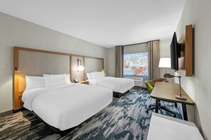 A hotel room with two beds, a desk, a chair, a TV, and a window with a view. - Fairfield By Marriott Inn & Suites Emporia (Emporia)