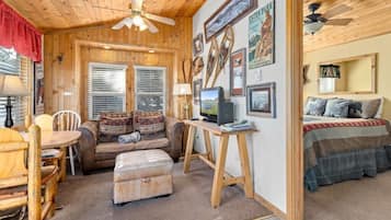 1 habitación, tabla de planchar con plancha y cuna de viaje