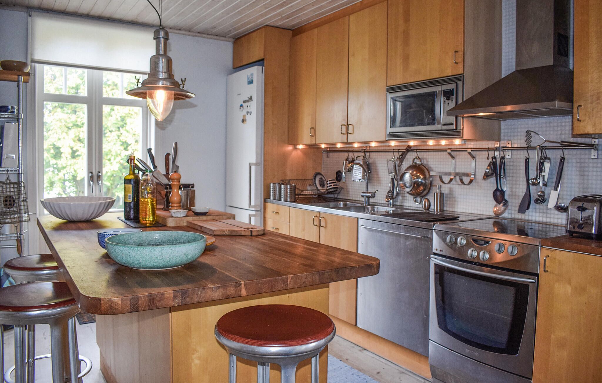 Fridge, stovetop, dishwasher, coffee/tea maker