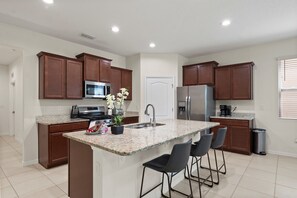 Fridge, microwave, oven, stovetop - Stunning 6-Bedroom Pool Home Minutes from Disney (Davenport)
