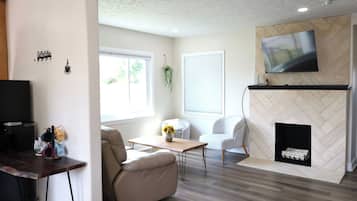 Smart TV, fireplace, books