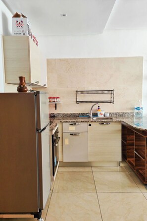 Fridge, oven, cookware/dishes/utensils