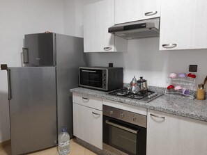 Fridge, microwave, oven, cookware/dishes/utensils