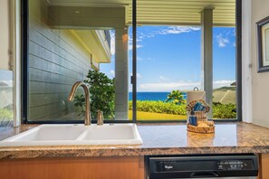 A kitchen with a granite countertop, a stainless steel sink, and a dishwasher. - Kapalua Bay | Ocean View 2 BR, Sleeps 8 | Car Incl. w/ 6+ Nights | KBV ML-3488 by KBM (Lahaina)